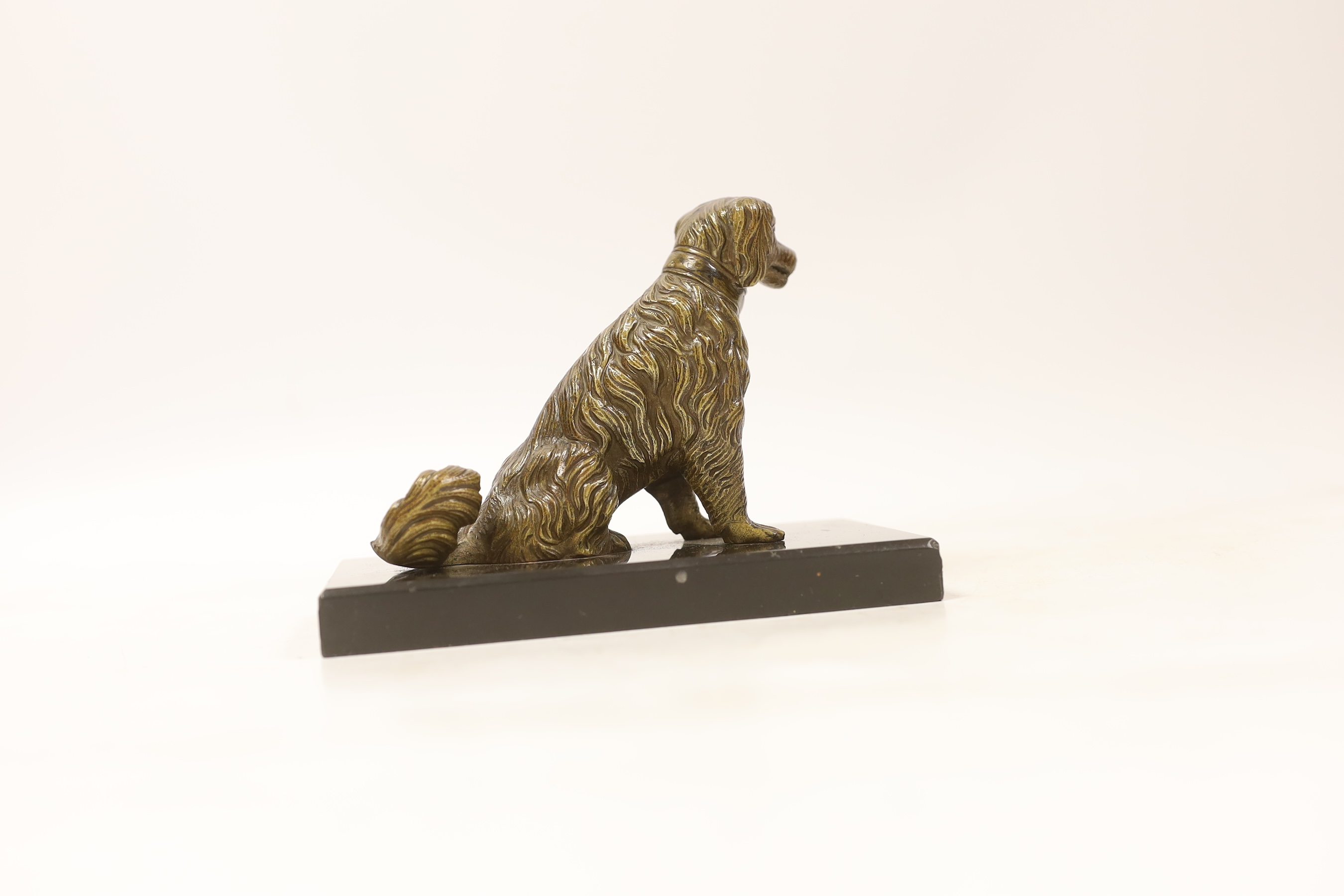 A novelty bronze dog card holder, with articulated jaw, base 14.5cm wide